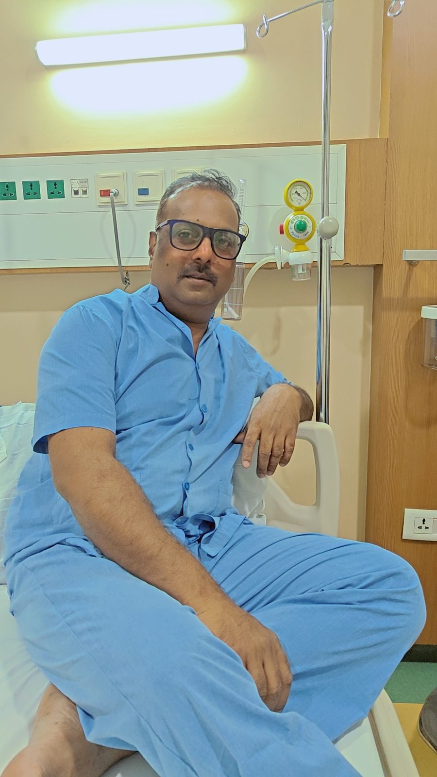 My father, sitting up in his hospital room.